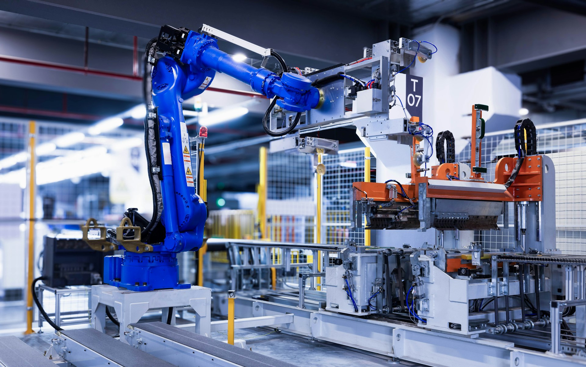 Robotic arm on an automated manufacturing assembly line